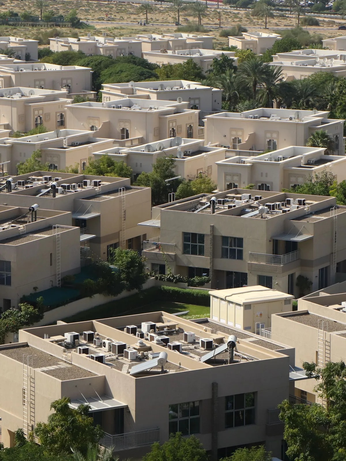 Aerial view of Dubai villas among gardens, like the independent Al Safa homes we automate