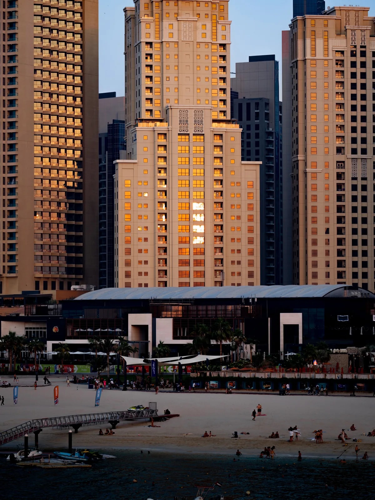 JBR beachfront towers above The Beach and the sand, where we design home automation