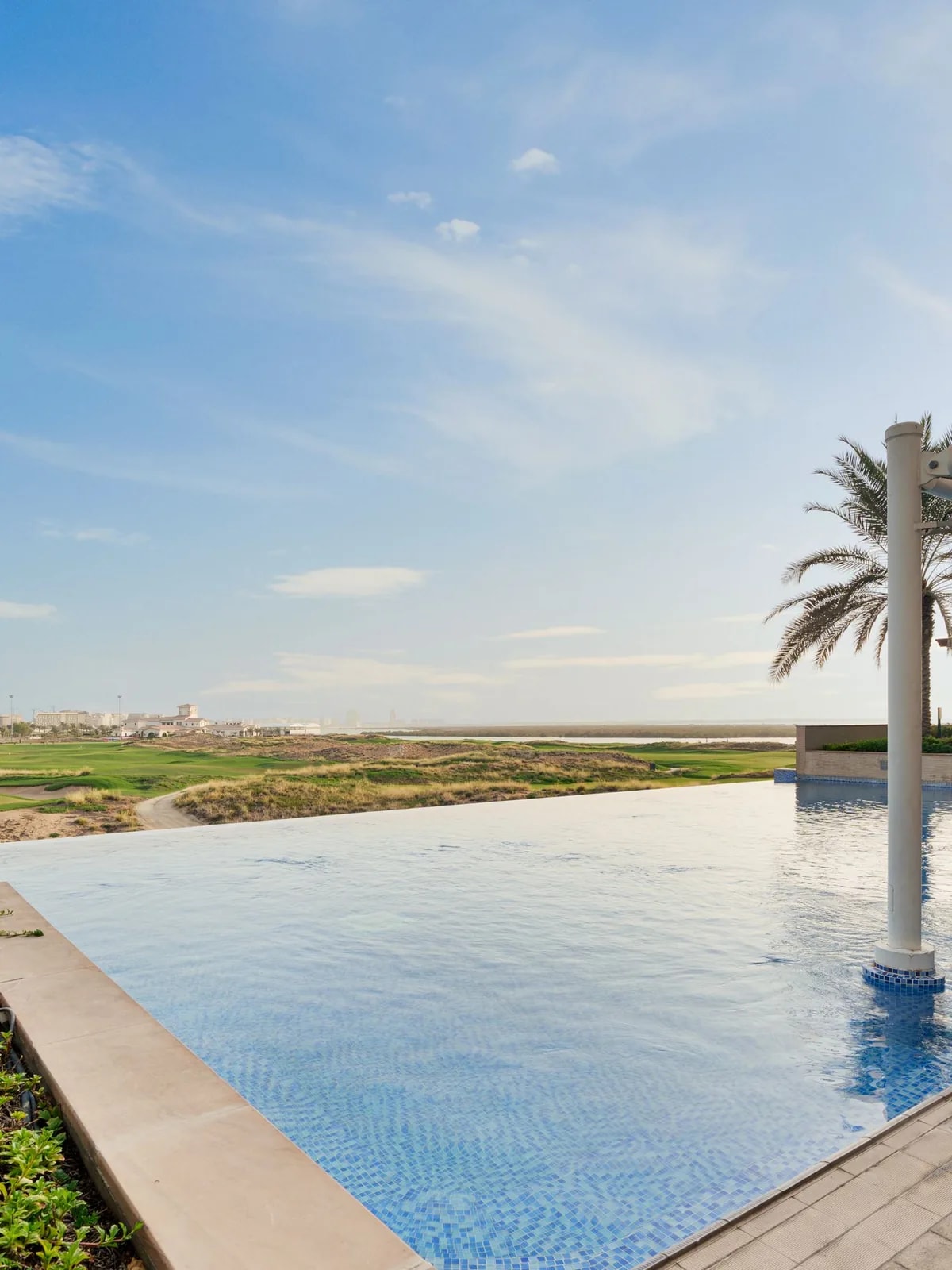 Villa pool looking out over a golf fairway, the kind of view Jumeirah Golf Estates homes are built around