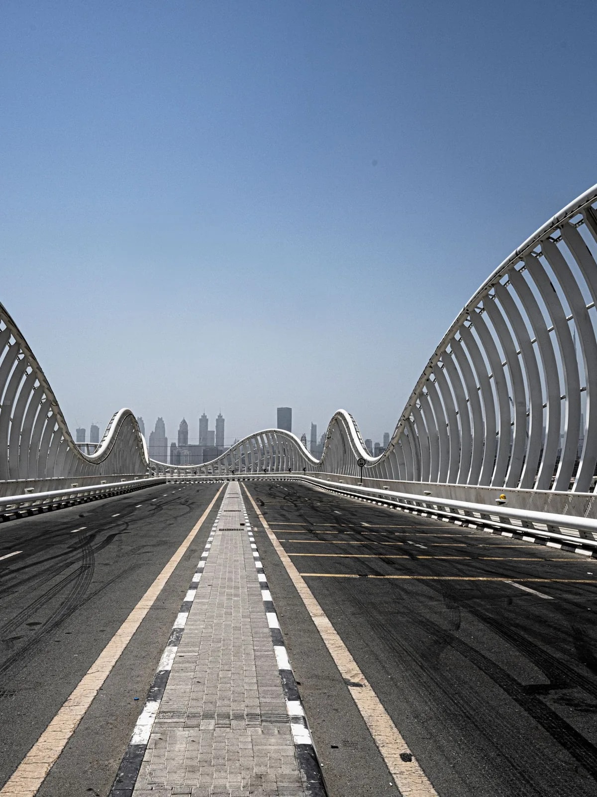 White wave-shaped arches of Meydan Bridge, near the Meydan homes we design home automation for