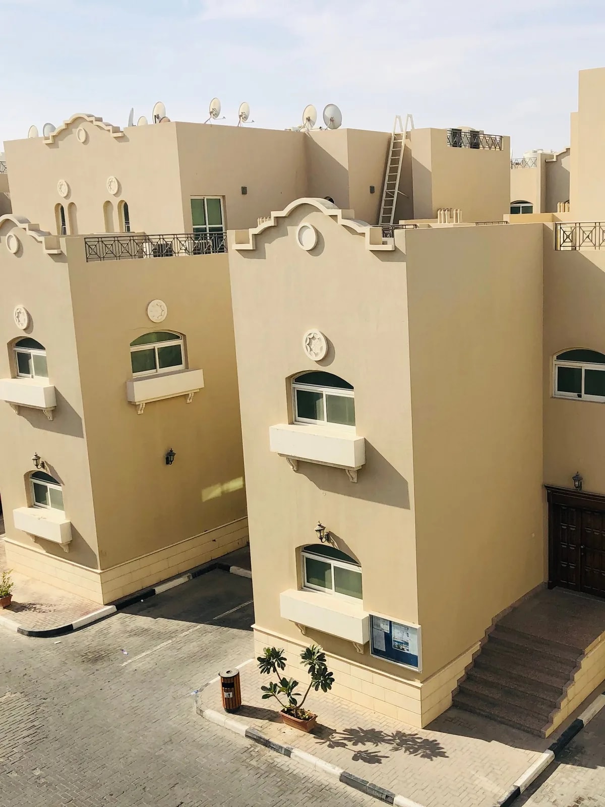 Beige Arabic-style homes with balconies, like the Reem townhouses in Mira and Mira Oasis we automate
