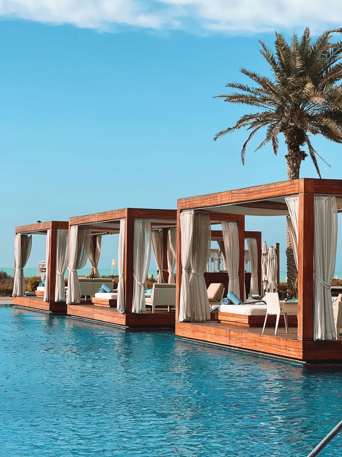 Pool cabanas at Saadiyat Beach Club, in the beachfront district where we design home automation