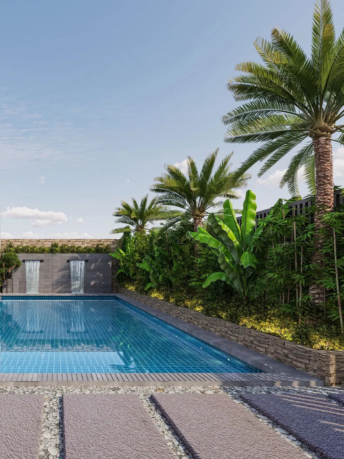 Villa pool, stone water feature and palms, like the Tilal Al Ghaf villas we automate