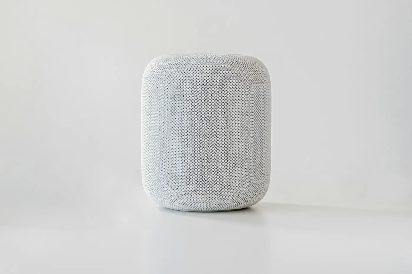 Apple HomePod smart speaker on a plain white surface