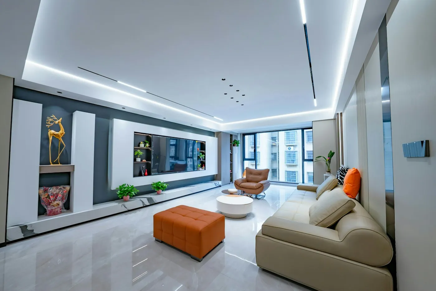 Modern high-rise apartment living room with ambient ceiling lighting